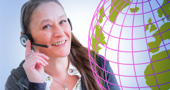 Smiling woman answering a phone call using a headset, overlaid with a stylised image of the globe.