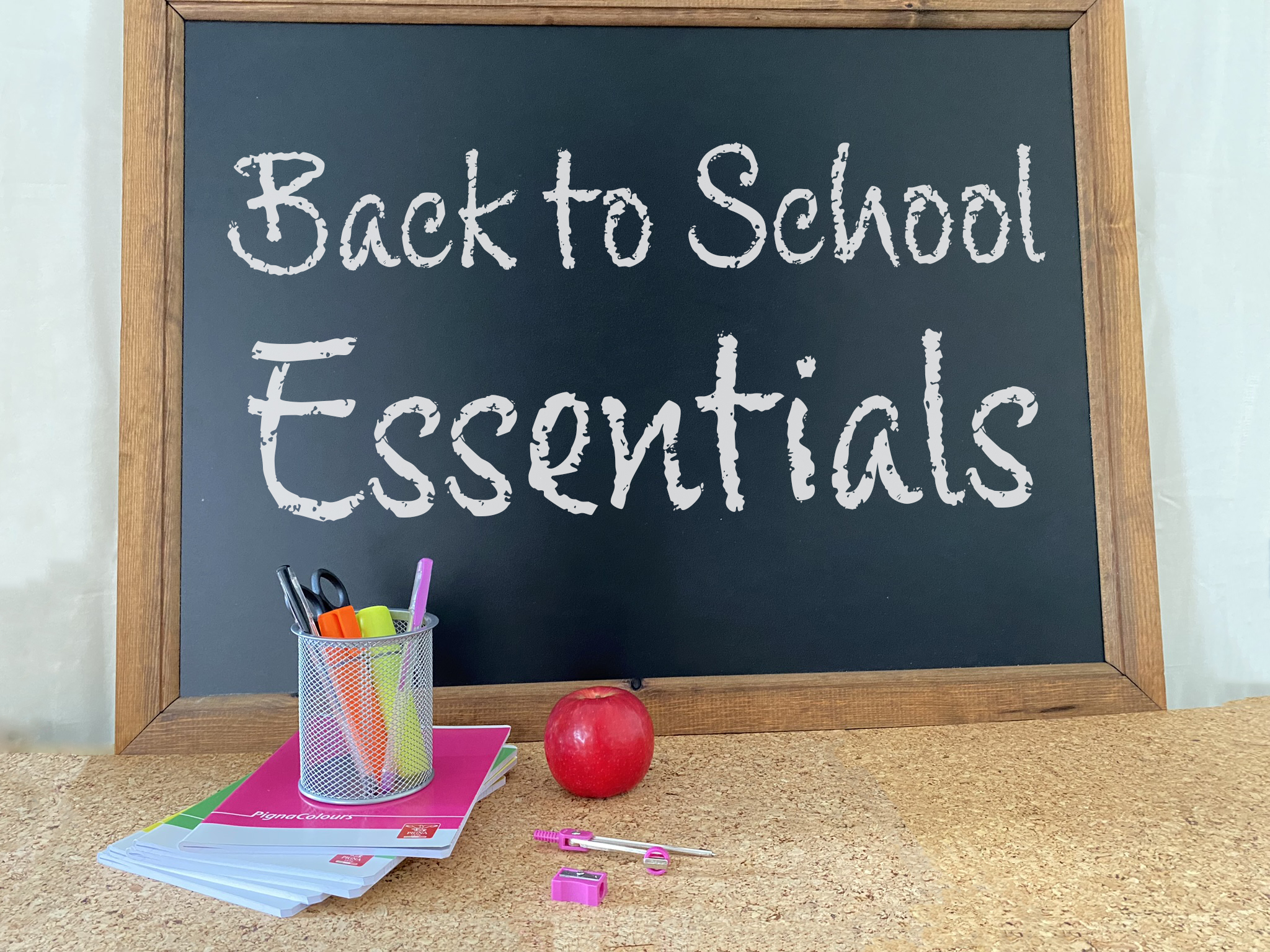 Image of a black board with school essentials written across