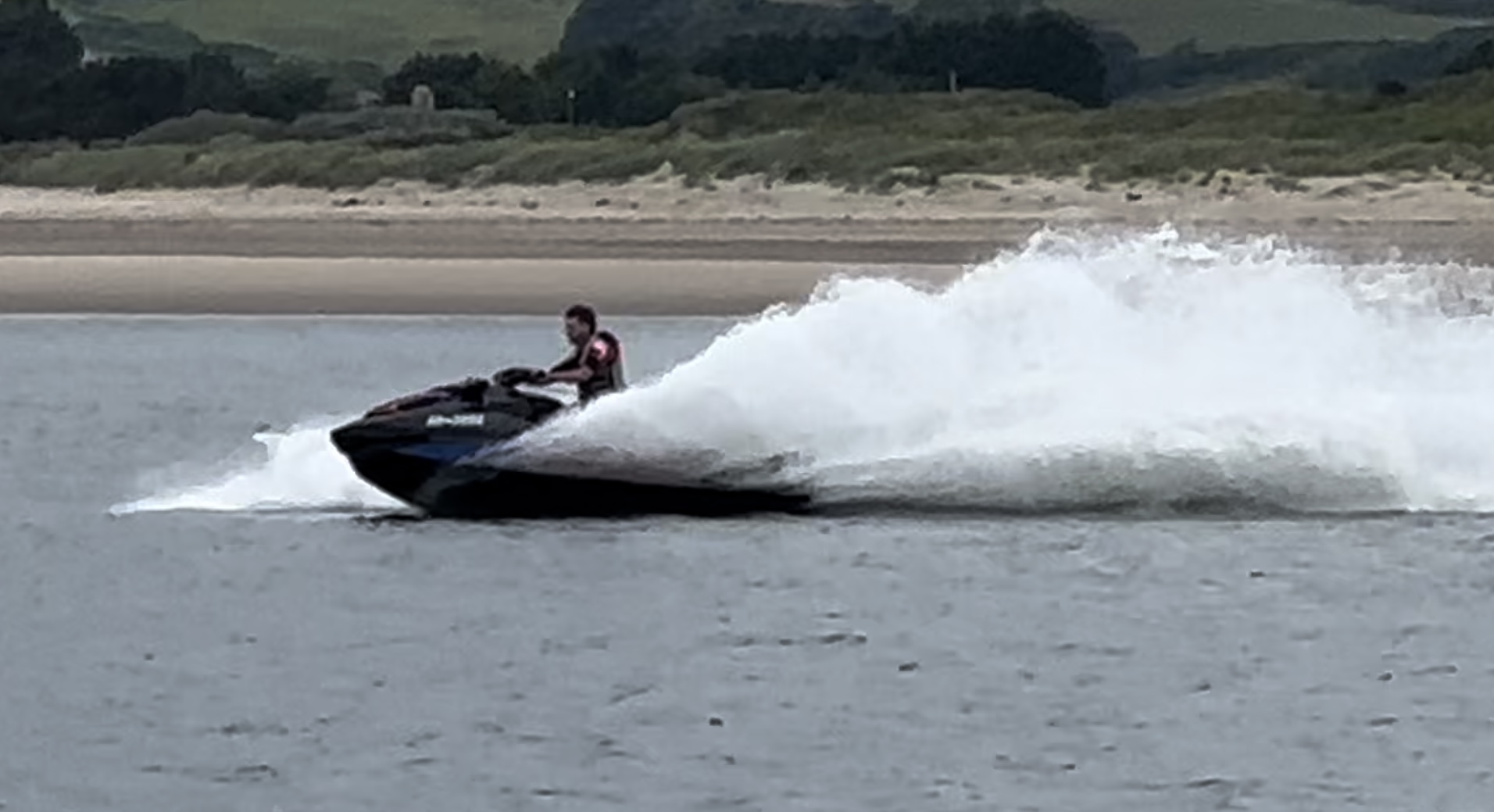 A jet ski zooming across the water.