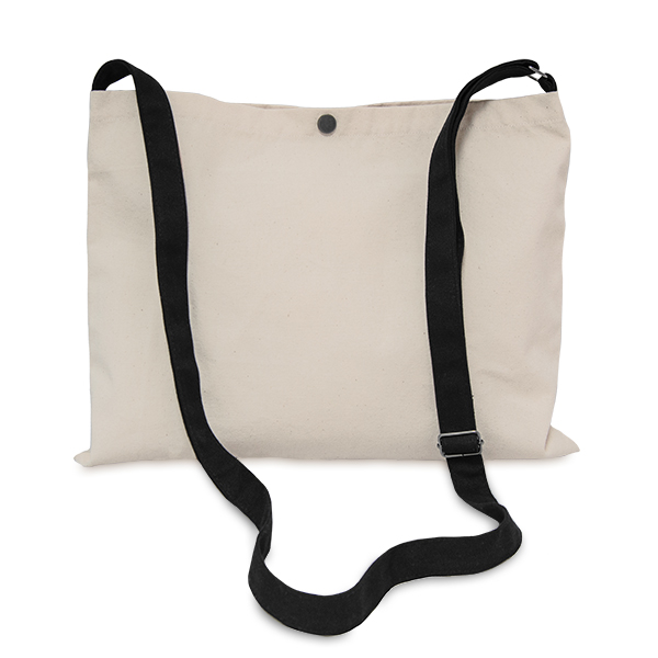 Product shot of a beige canvas musette bag. It is wider than it is tall, has a single long carrying strap with metal slider adjustment, and a poppa in the centre of the top opening.