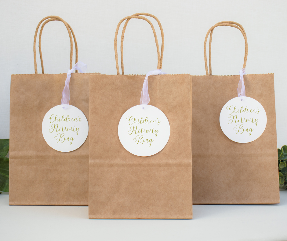 A group of brown paper bags with white tags