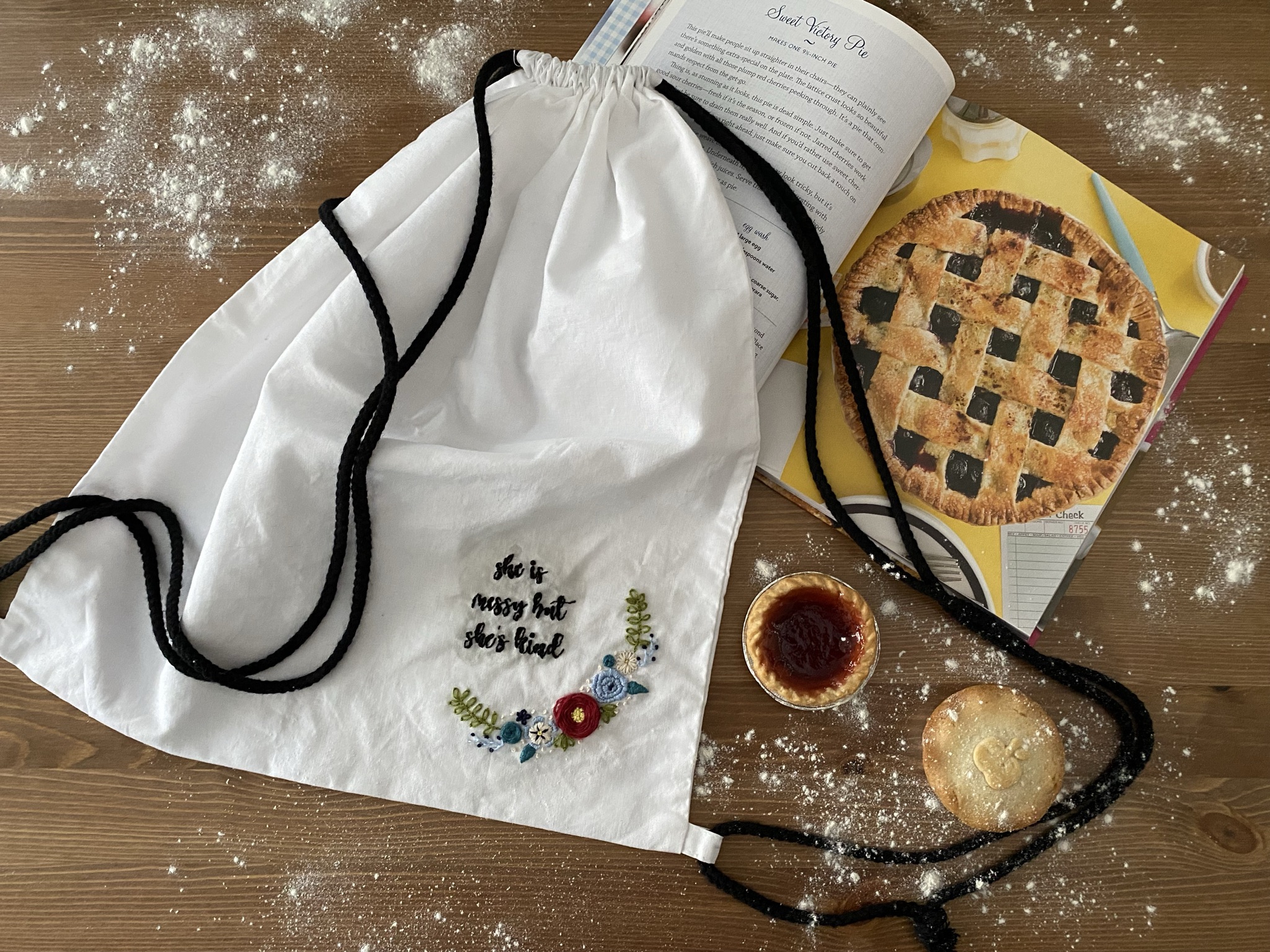 image of a white cotton duffel bag which has been customised with some pie musical inspired images