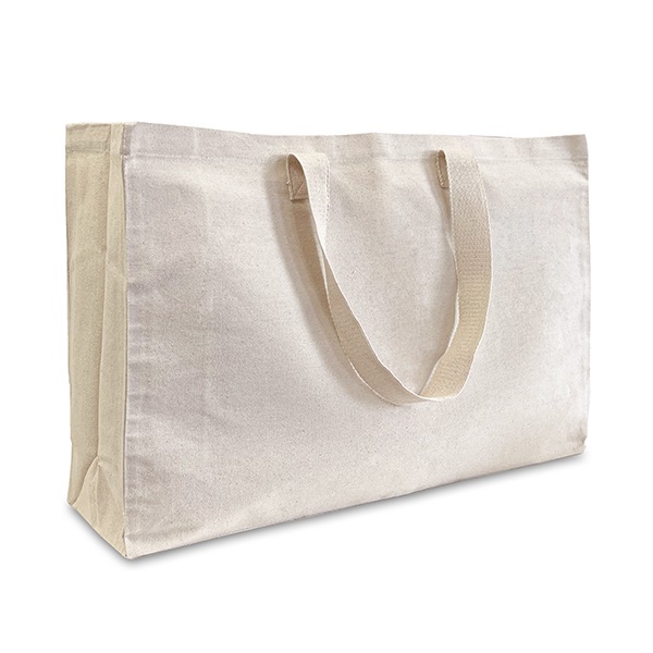 Large beige cotton canvas tote bag, wider than it is tall, and with a deep all-round gusset to give even more capacity.