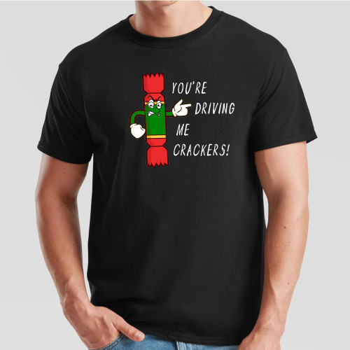 Black T-Shirt printed with text You’re Driving Me Crackers and a cartoon anthropomorphised Christmas cracker pointing to the wearer’s left.