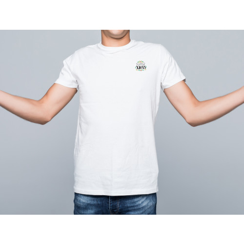 Model wearing white T-Shirt with discreet festive printed design